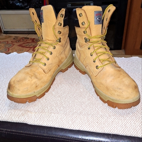 A pair of Herman Survivors leather boots in a men's size 11.5 Wide. Safety Toe. - Picture 1 of 12